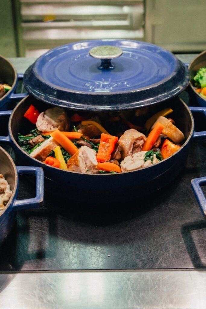 An array of delicious dishes in blue cooking pots, perfect for dinner or a buffet setup.