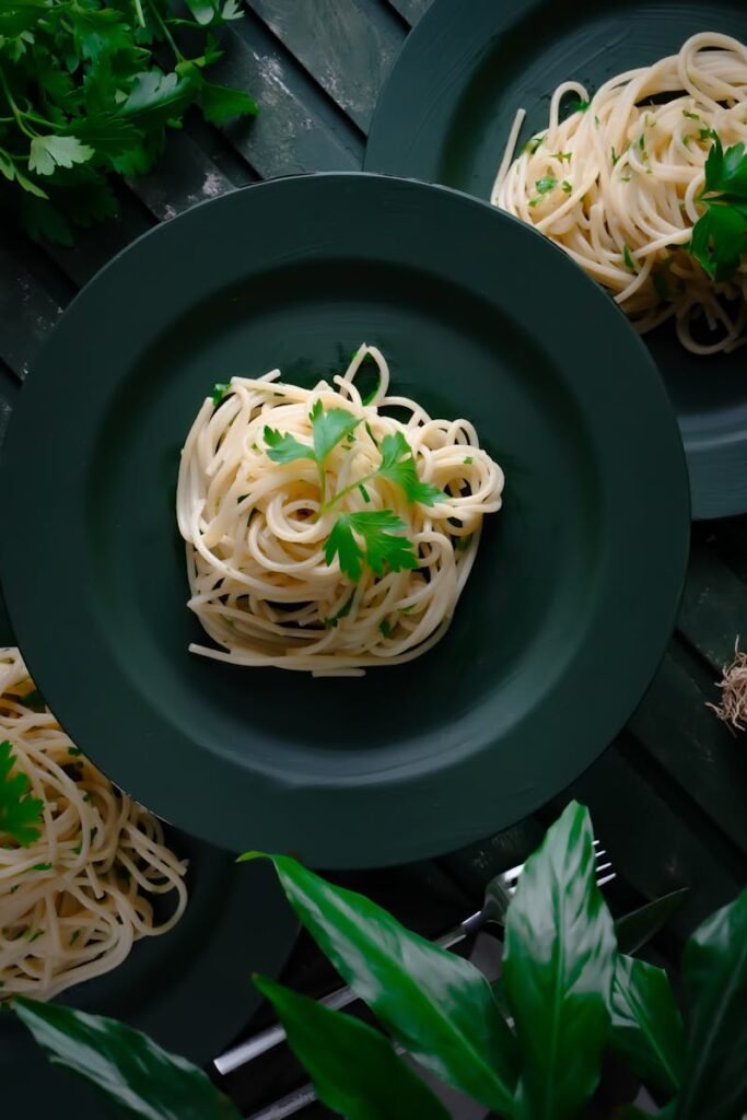 Delicious rustic spaghetti garnished with fresh parsley, perfect for a homemade meal.